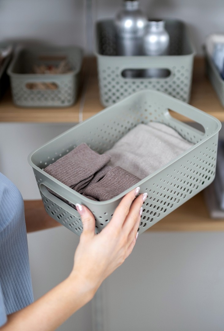 A close-up of SmartStore Essence storage baskets in a wardrobe